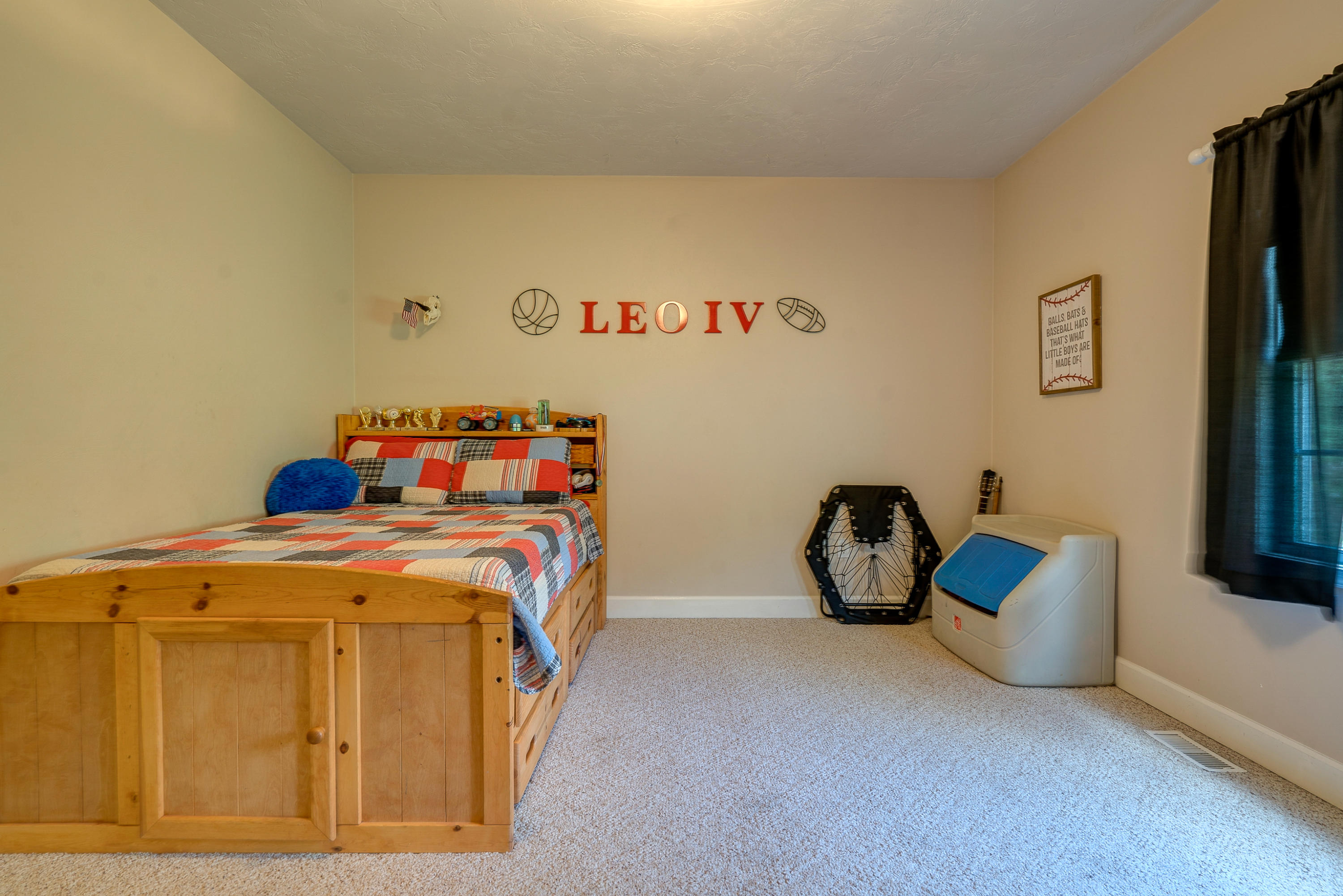 1205 Summit View Road Goodview, VA 24095 - Photo 19 of 46 a bedroom with a bed and a table in it