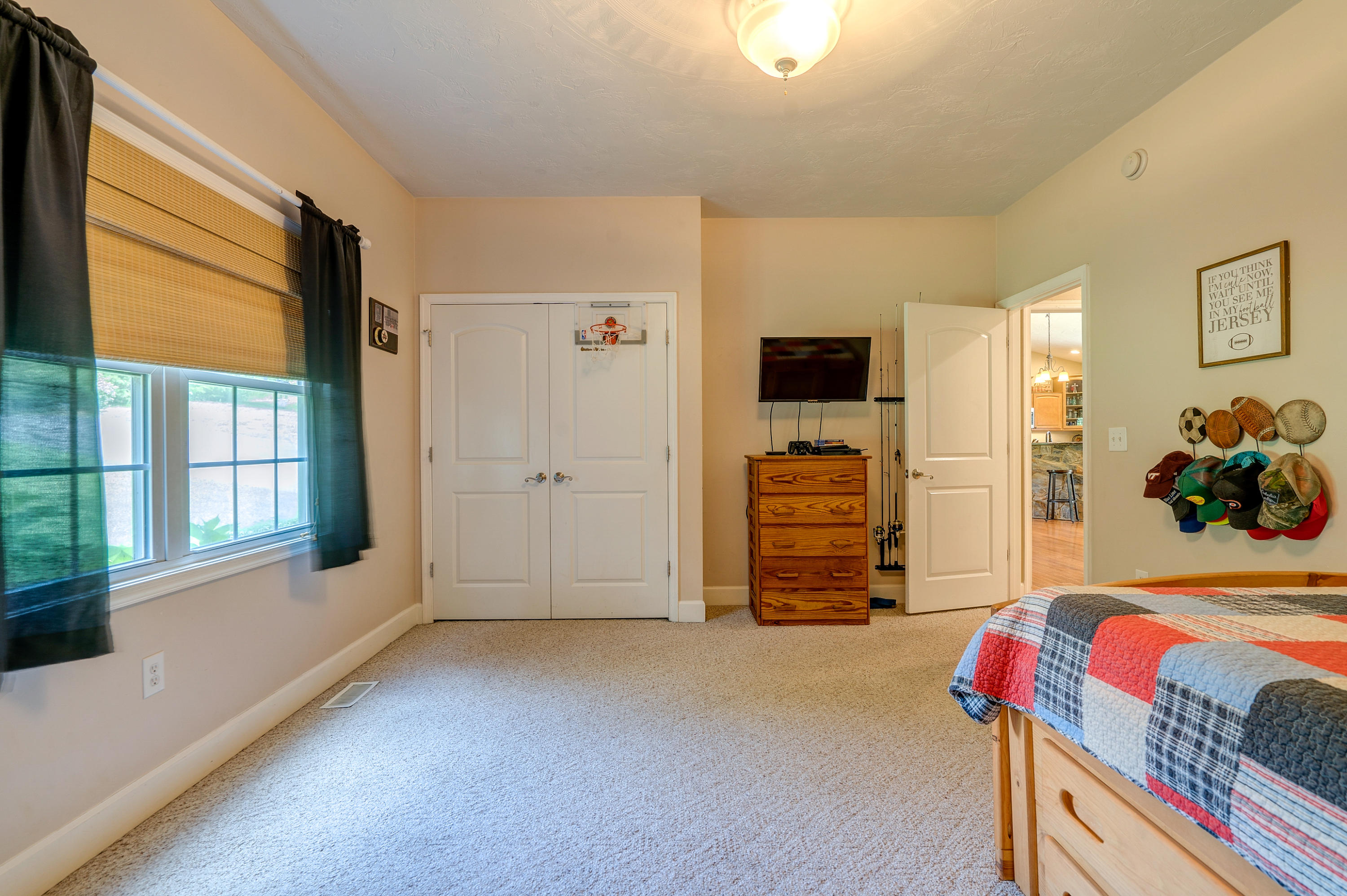 1205 Summit View Road Goodview, VA 24095 - Photo 20 of 46 a view of an empty room with furniture and a window