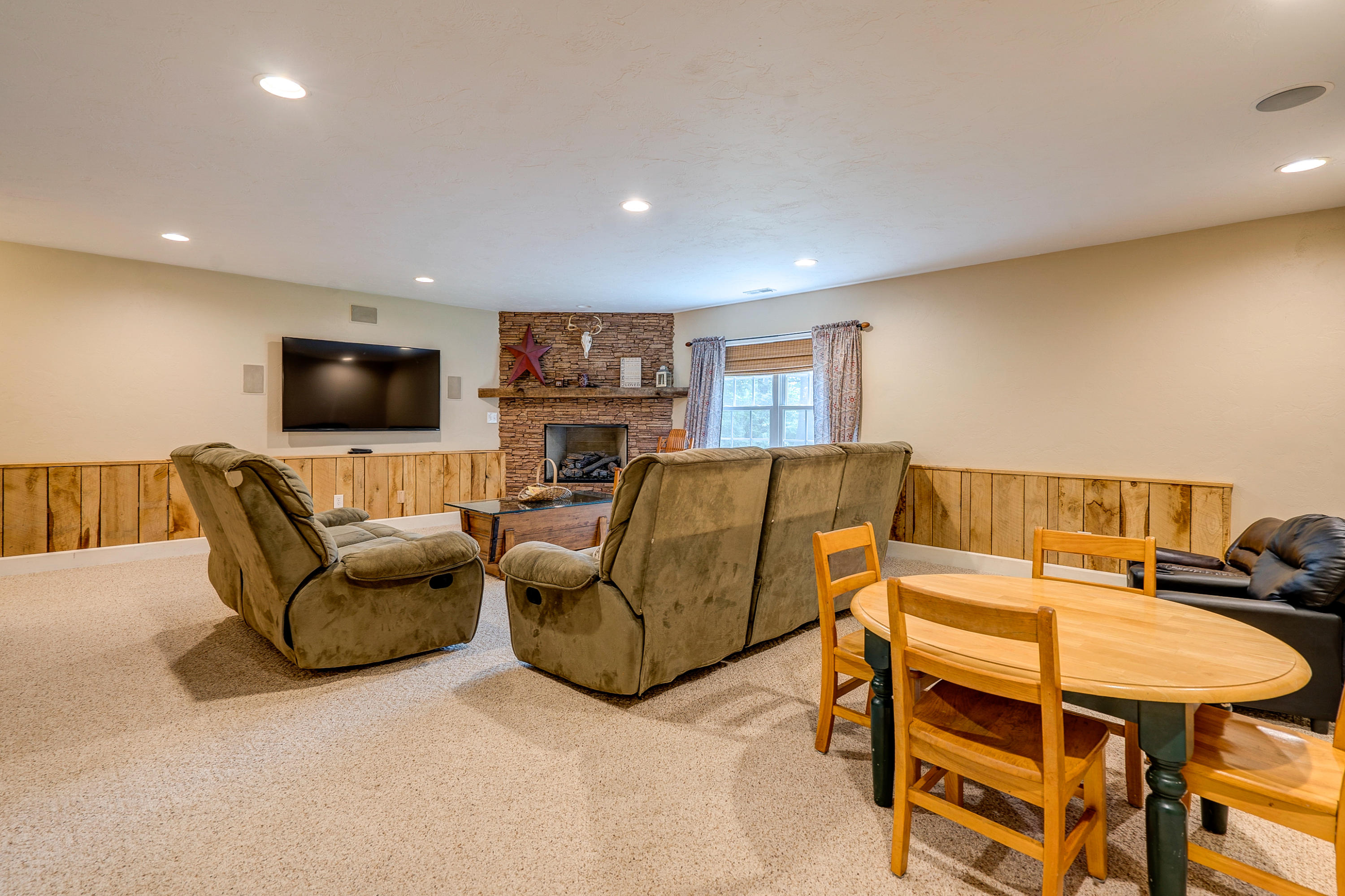 1205 Summit View Road Goodview, VA 24095 - Photo 30 of 46 a living room with furniture and a flat screen tv