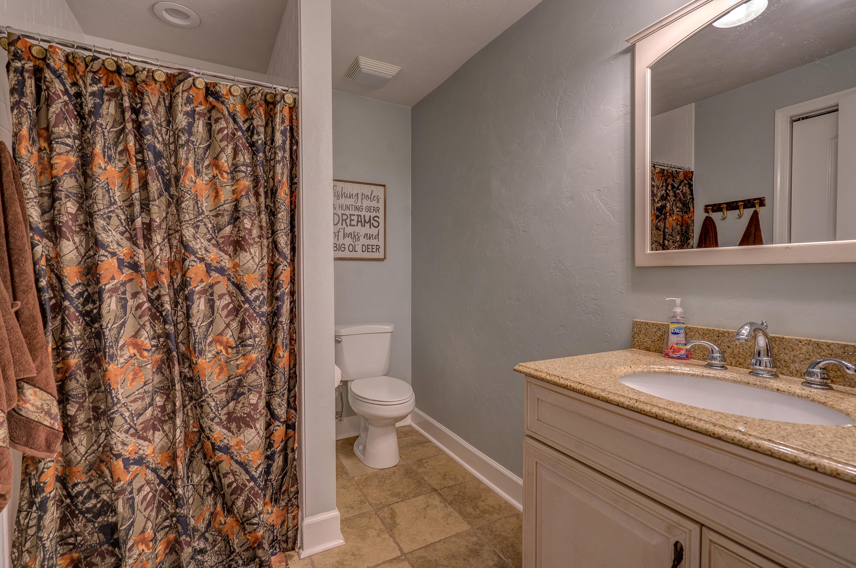 1205 Summit View Road Goodview, VA 24095 - Photo 37 of 46 a bathroom with a toilet sink and mirror