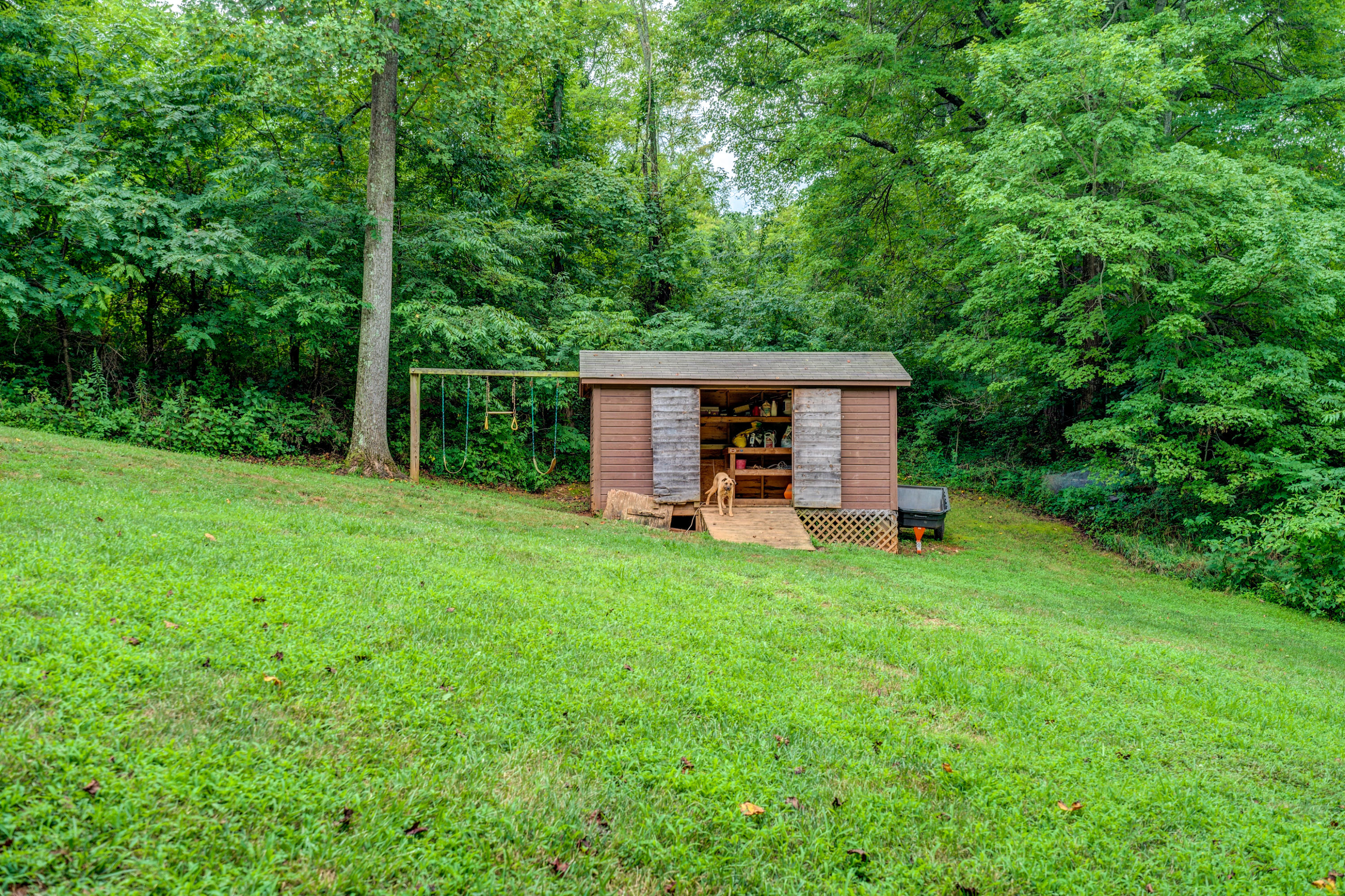 1205 Summit View Road Goodview, VA 24095 - Photo 43 of 46 a view of a wooden deck and a backyard
