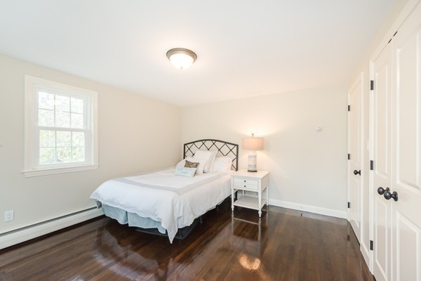 16 Mayflower Road Winchester, MA 01890 - Photo 11 of 23 a bedroom with a bed and a window