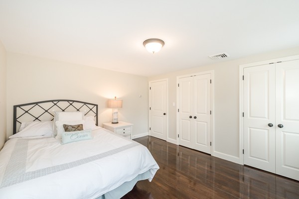 16 Mayflower Road Winchester, MA 01890 - Photo 13 of 23 a bedroom with a bed and a night stand