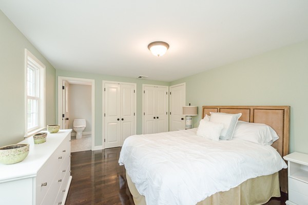 16 Mayflower Road Winchester, MA 01890 - Photo 14 of 23 a spacious bedroom with a bed and a large mirror