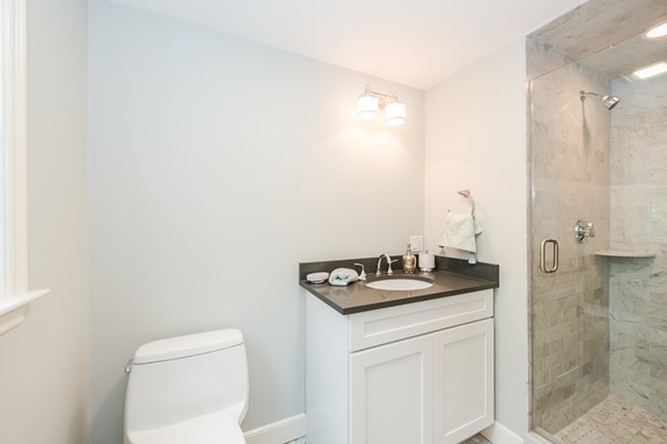 16 Mayflower Road Winchester, MA 01890 - Photo 15 of 23 a bathroom with a granite countertop sink and a toilet