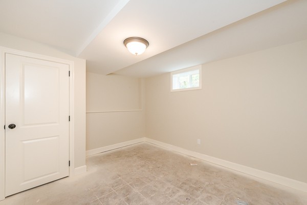 16 Mayflower Road Winchester, MA 01890 - Photo 19 of 23 an empty room with a hallway