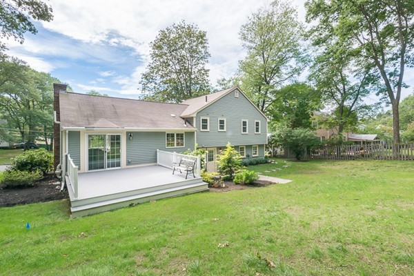16 Mayflower Road Winchester, MA 01890 - Photo 21 of 23 a view of a house with a yard and sitting area
