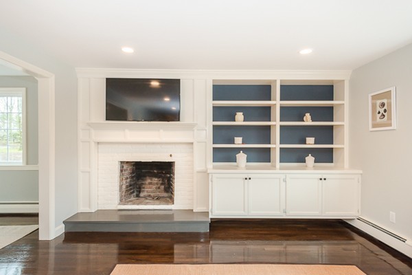 16 Mayflower Road Winchester, MA 01890 - Photo 3 of 23 a living room with furniture and a fireplace