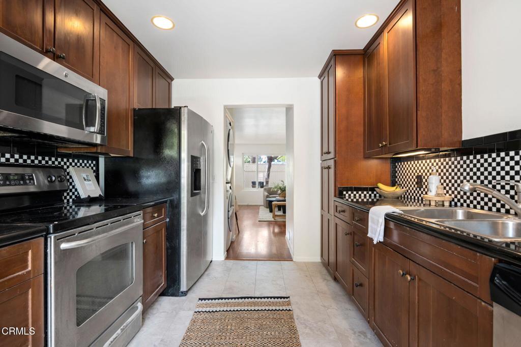3914 Via Lucero, Unit B Santa Barbara, CA 93110 - Photo 12 of 22 a kitchen with stainless steel appliances granite countertop a refrigerator and a stove top oven