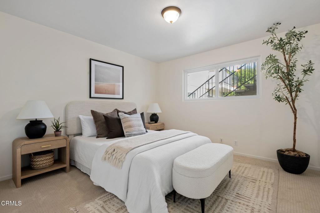 3914 Via Lucero, Unit B Santa Barbara, CA 93110 - Photo 15 of 22 a bedroom with a bed and a painting on the wall