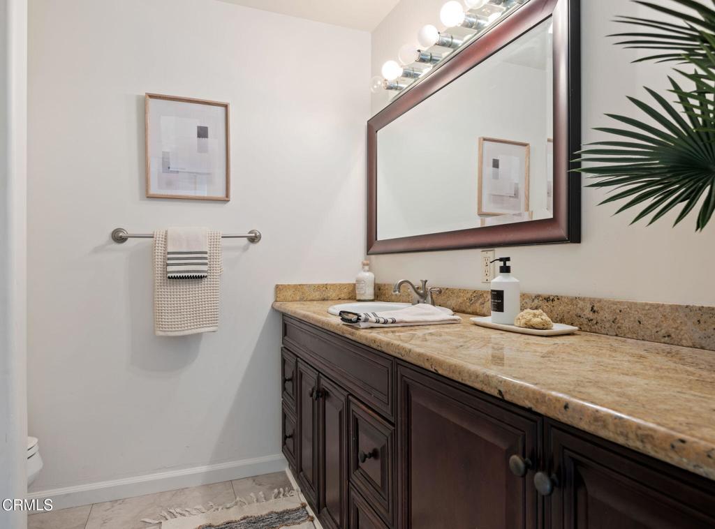 3914 Via Lucero, Unit B Santa Barbara, CA 93110 - Photo 17 of 22 a bathroom with a granite countertop sink two mirror and a