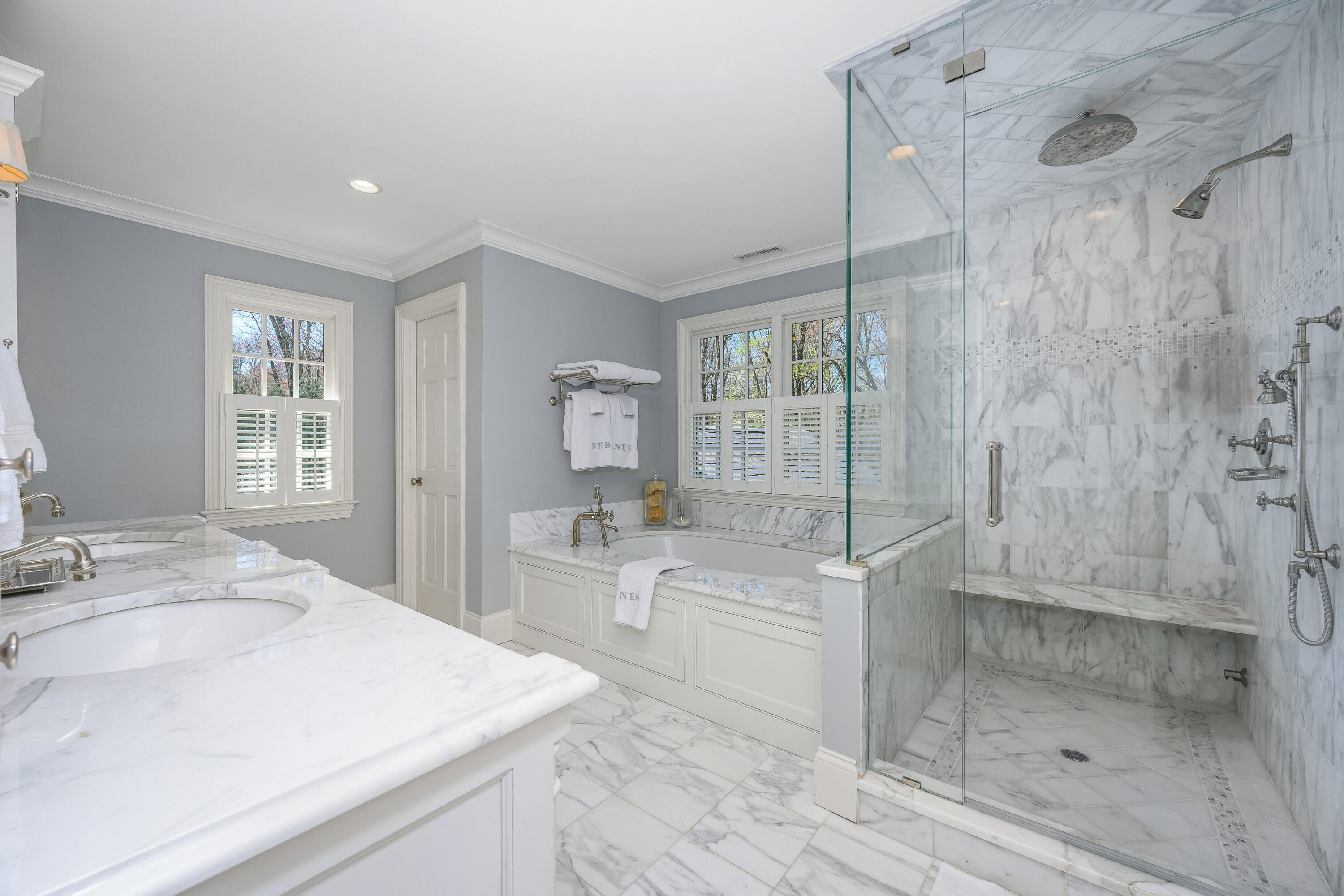 110 Stephen Mather Road Darien, CT 06820 - Photo 17 of 41 a spacious bathroom with a granite countertop sink a toilet a mirror and shower