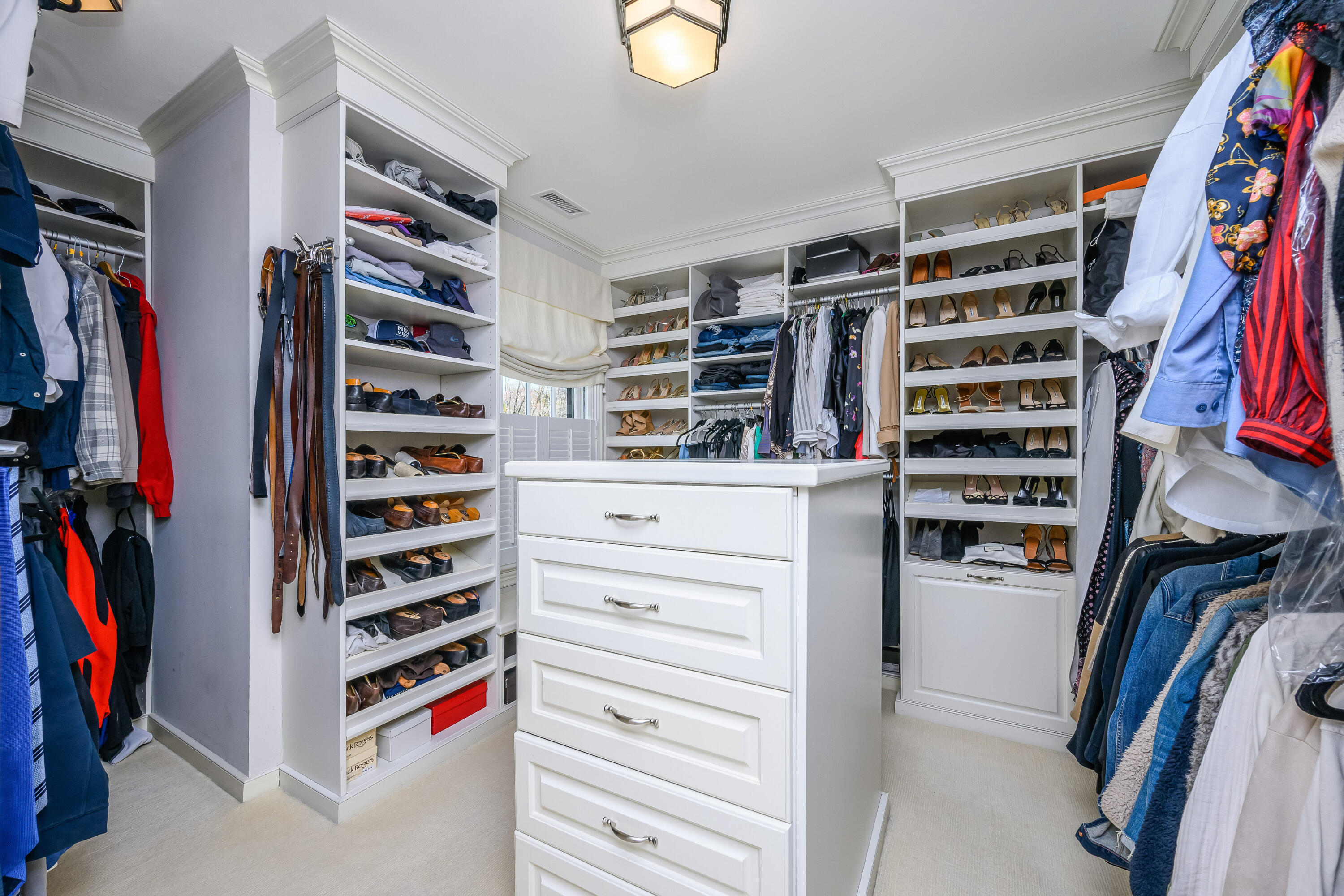 110 Stephen Mather Road Darien, CT 06820 - Photo 18 of 41 a view of walk in closet with clothes and shoes