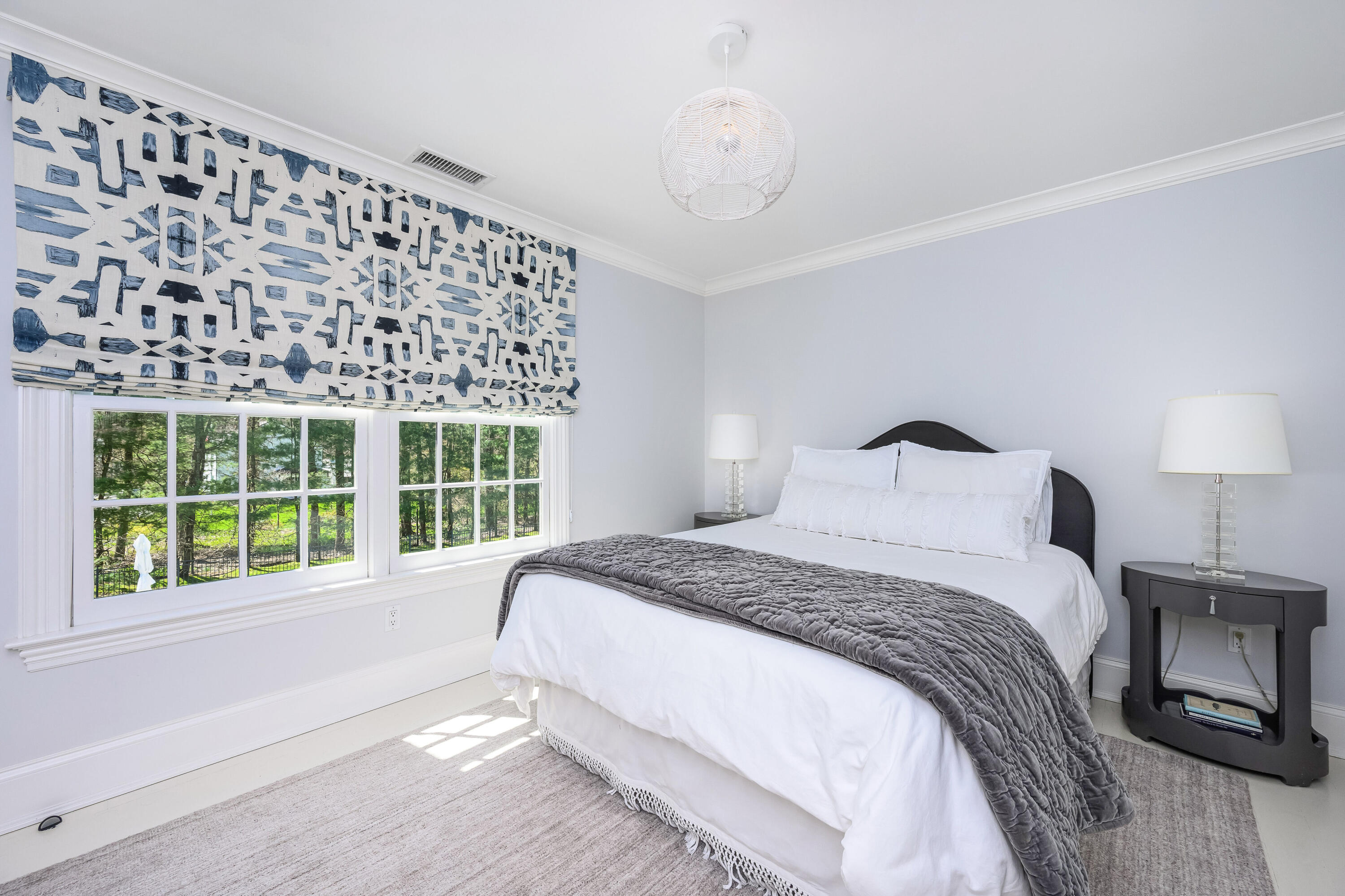 110 Stephen Mather Road Darien, CT 06820 - Photo 24 of 41 a large bed sitting in a bedroom next to a window