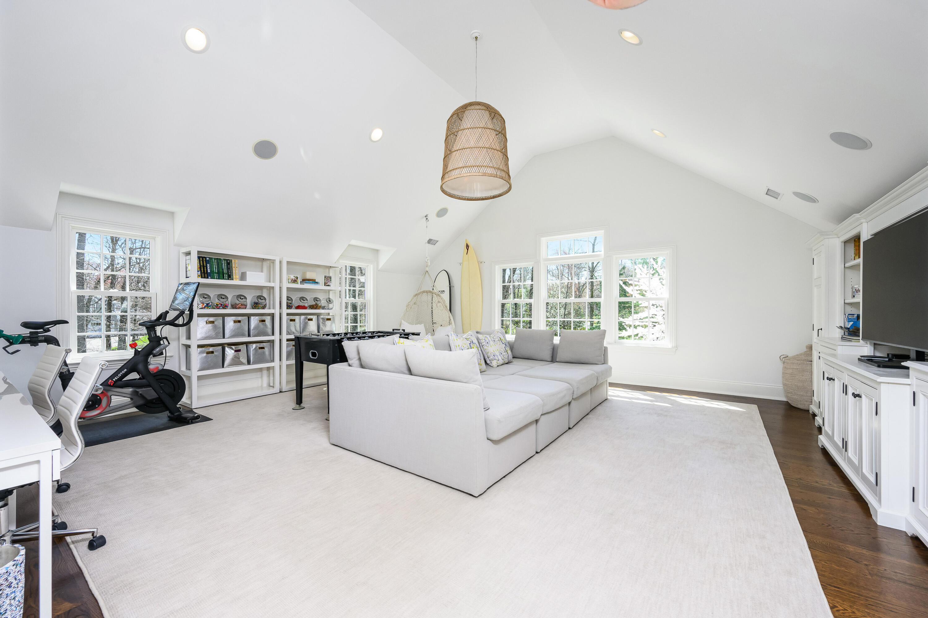 110 Stephen Mather Road Darien, CT 06820 - Photo 26 of 41 a living room with furniture a flat screen tv and a large window