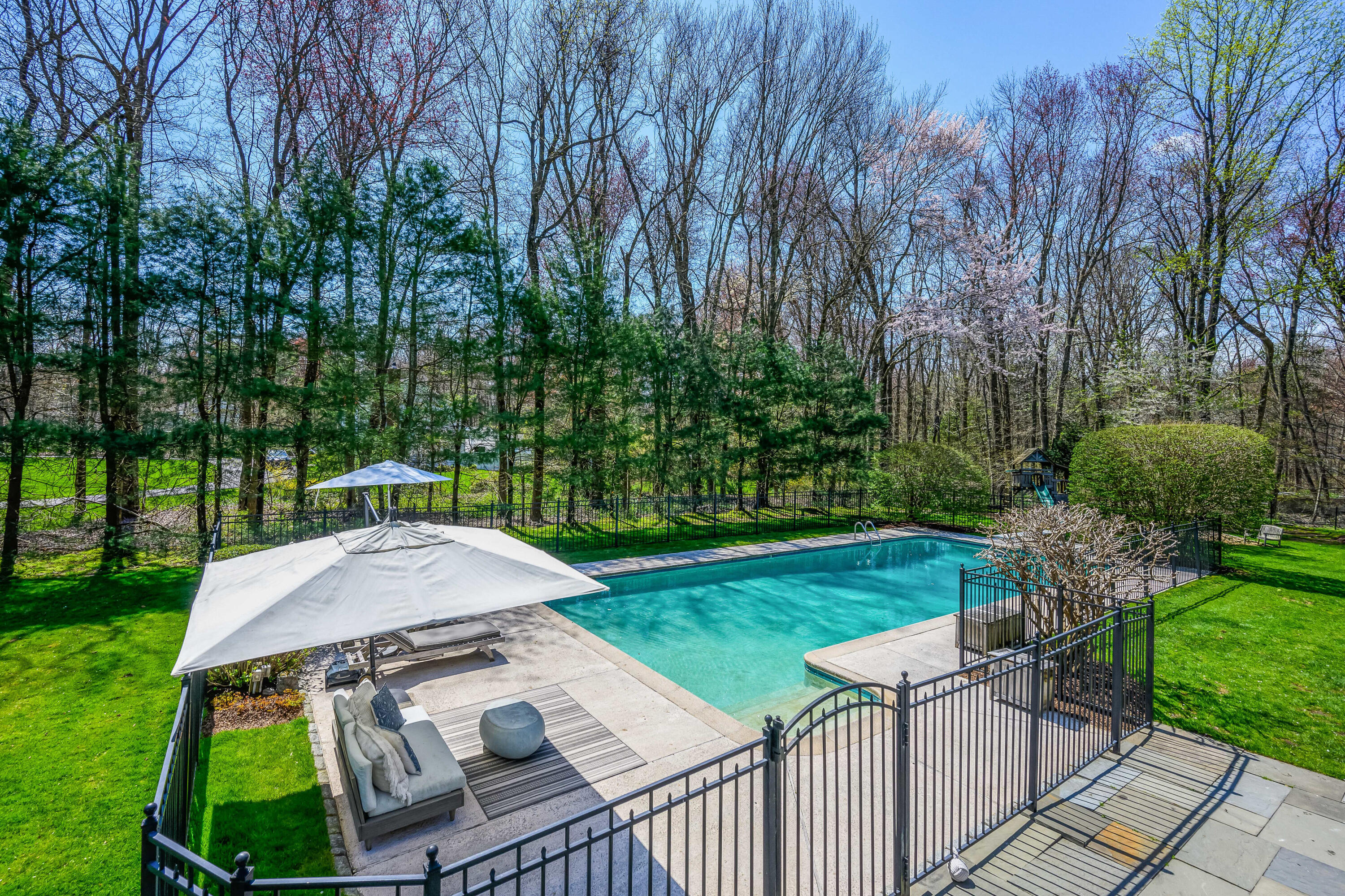 110 Stephen Mather Road Darien, CT 06820 - Photo 31 of 41 a view of a table and chairs in backyard