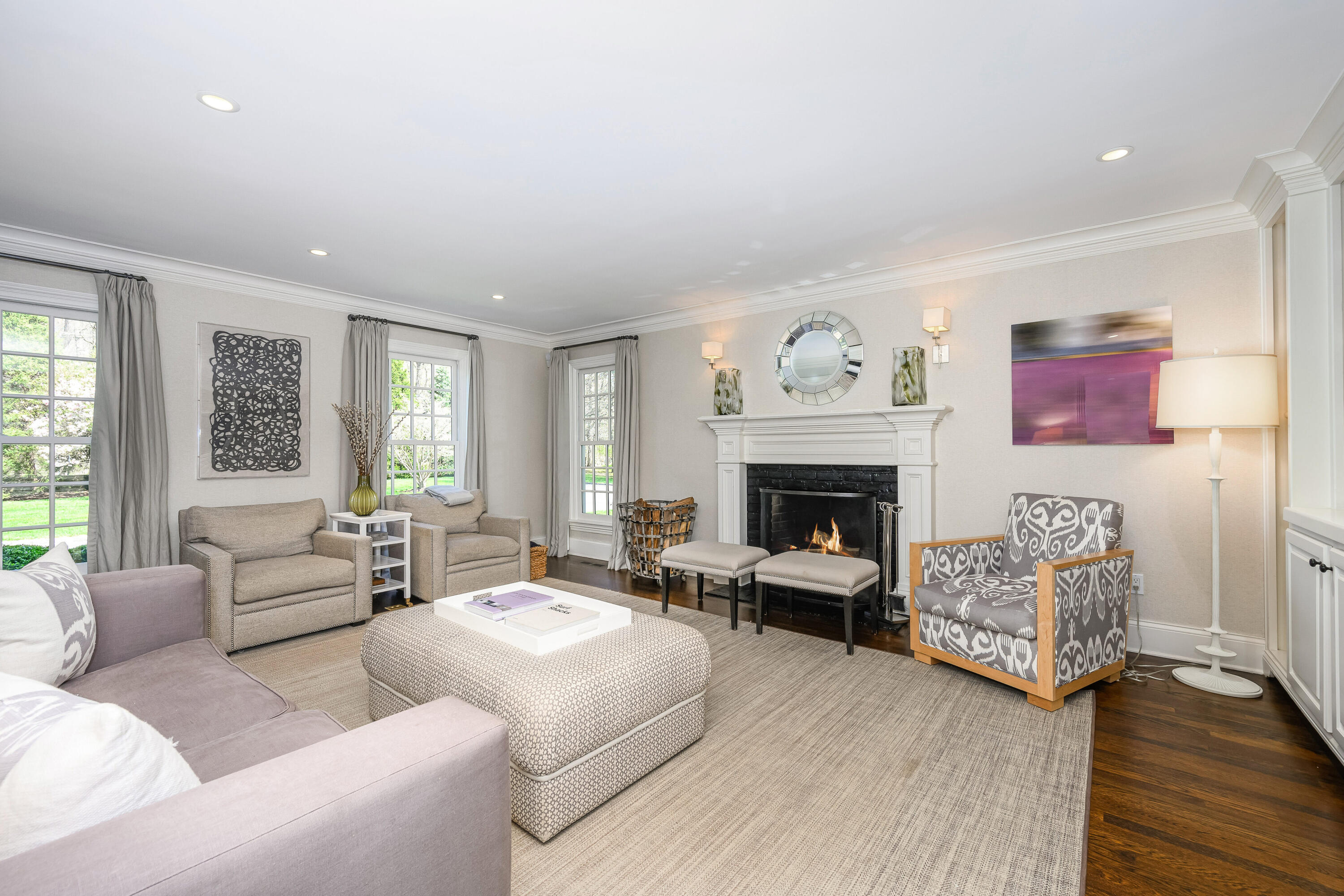 110 Stephen Mather Road Darien, CT 06820 - Photo 8 of 41 a living room with furniture and a fireplace