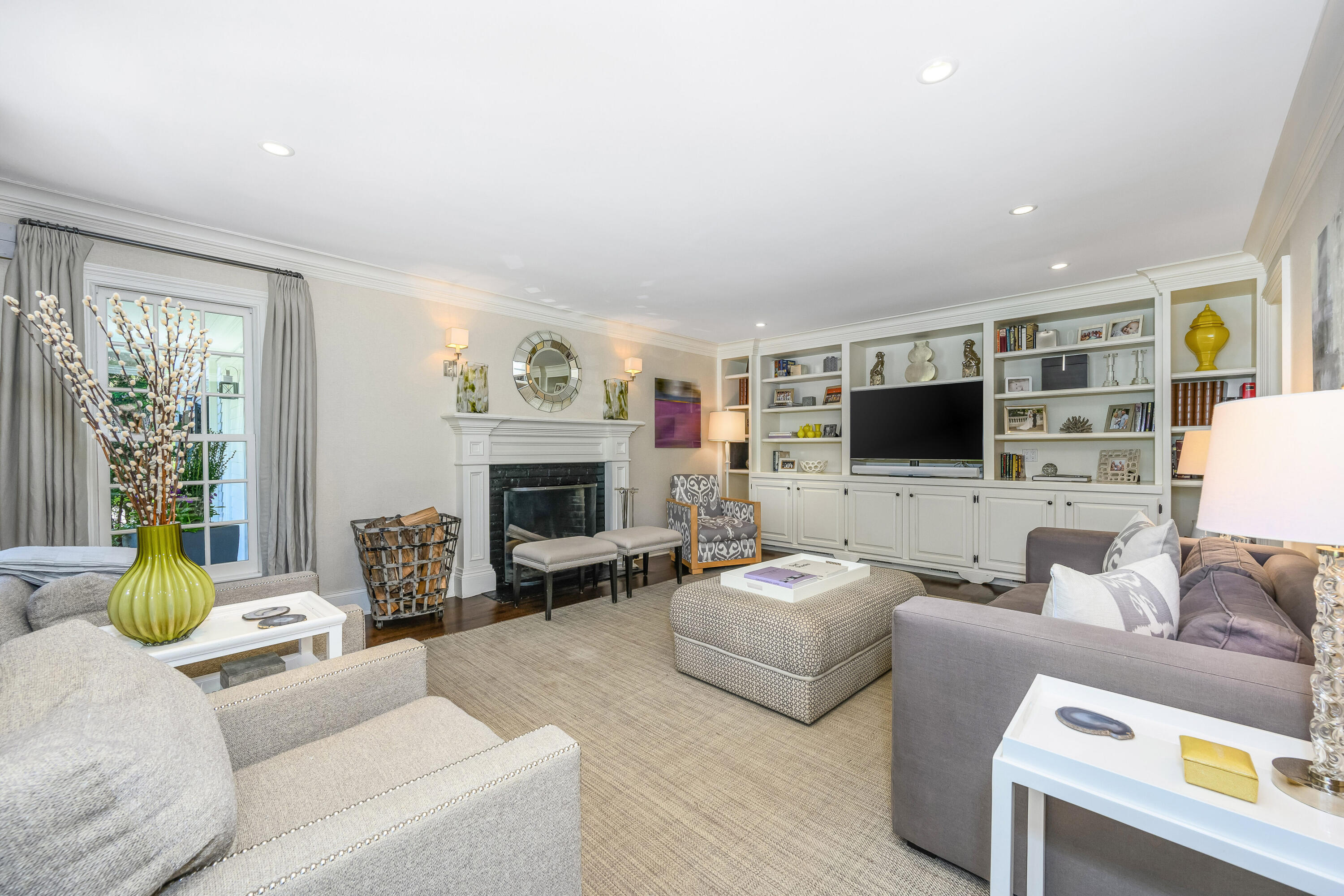 110 Stephen Mather Road Darien, CT 06820 - Photo 9 of 41 a living room with furniture and a flat screen tv