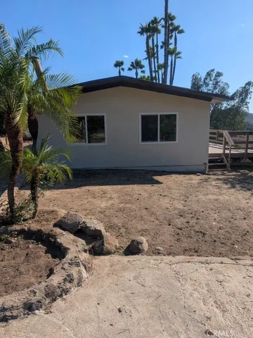 a house with trees in the background
