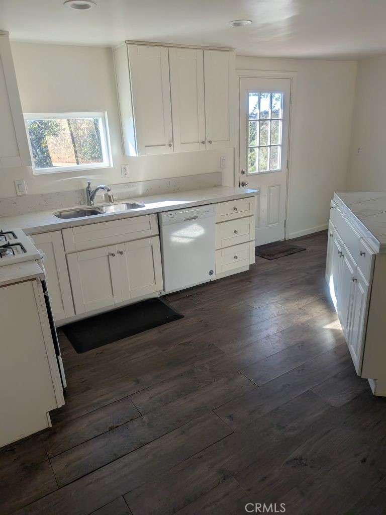 4287 Rosa Rancho Lane Fallbrook, CA 92028 - Photo 8 of 24 a kitchen with granite countertop white cabinets and white appliances