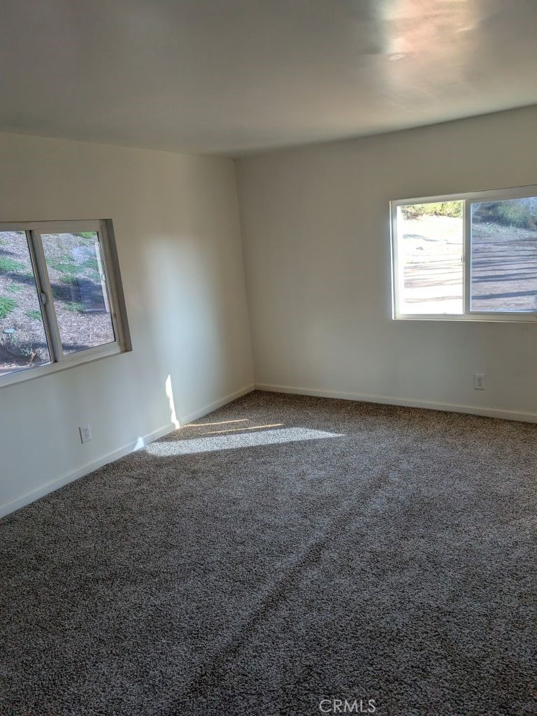 4287 Rosa Rancho Lane Fallbrook, CA 92028 - Photo 9 of 24 an empty room with windows