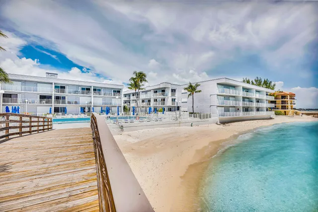 a view of a swimming pool with outdoor seating