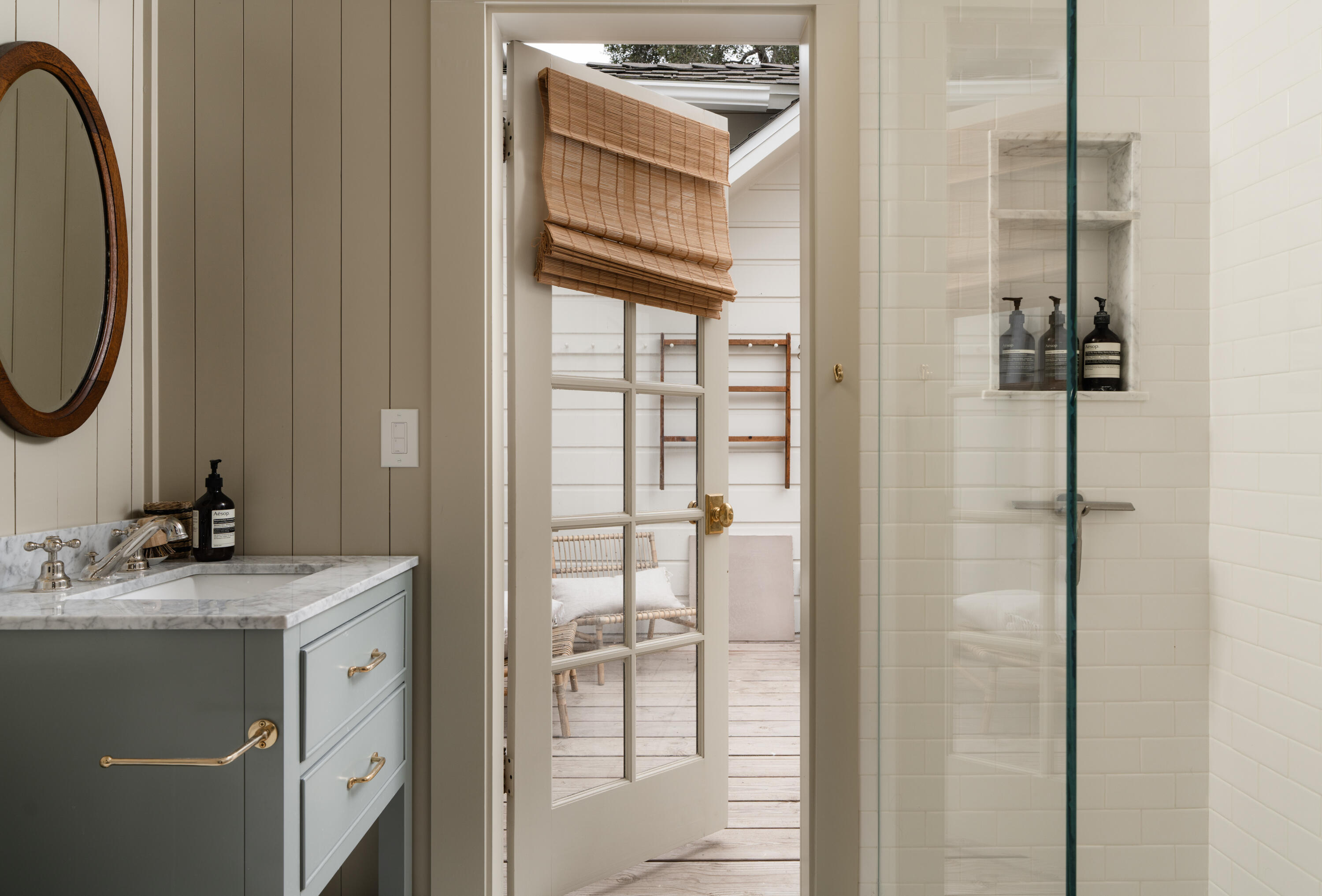 1575 East Valley Road Montecito, CA 93108 - Photo 15 of 30 a bathroom with a sink a mirror and shower