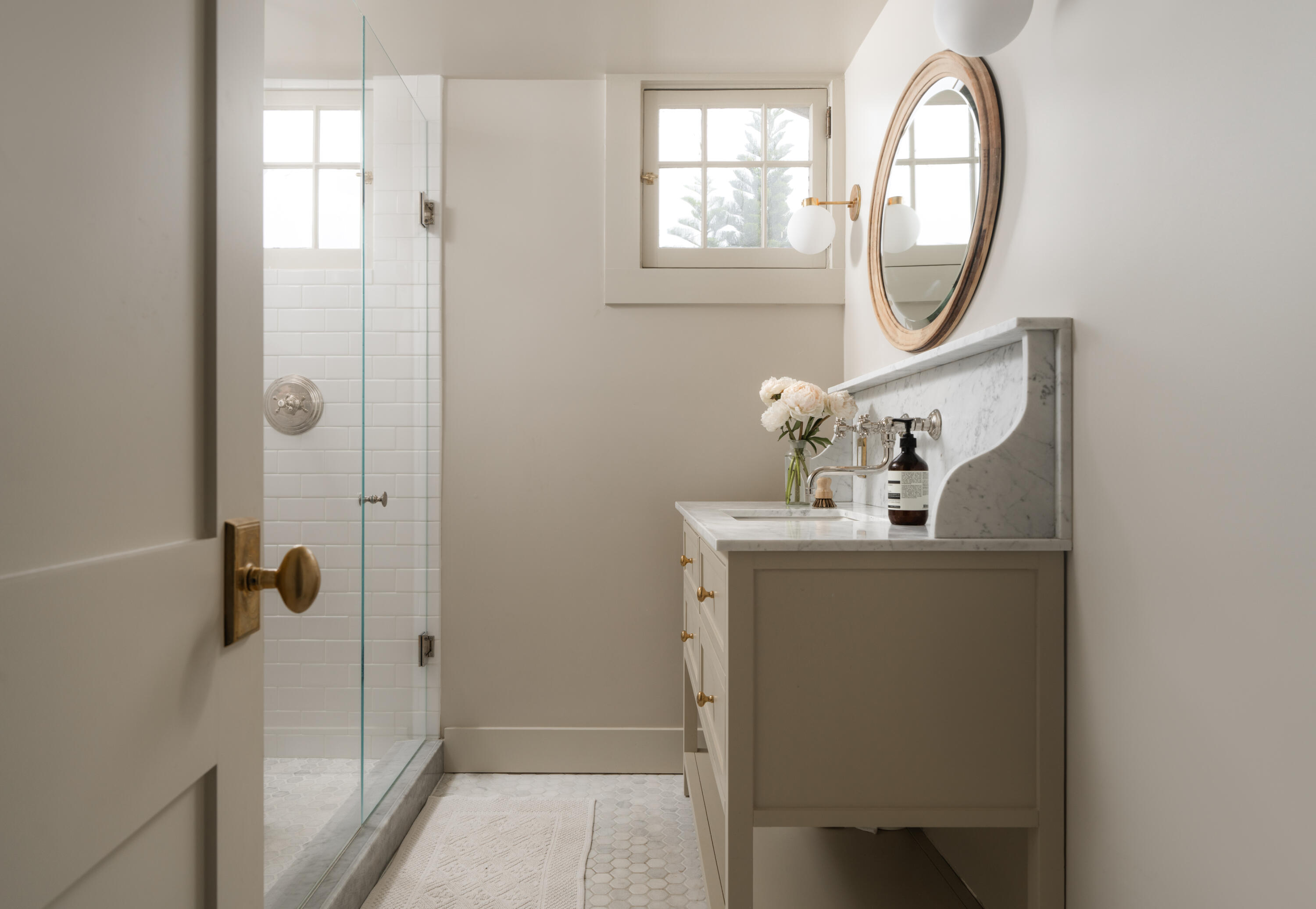 1575 East Valley Road Montecito, CA 93108 - Photo 18 of 30 a bathroom with a sink and a mirror