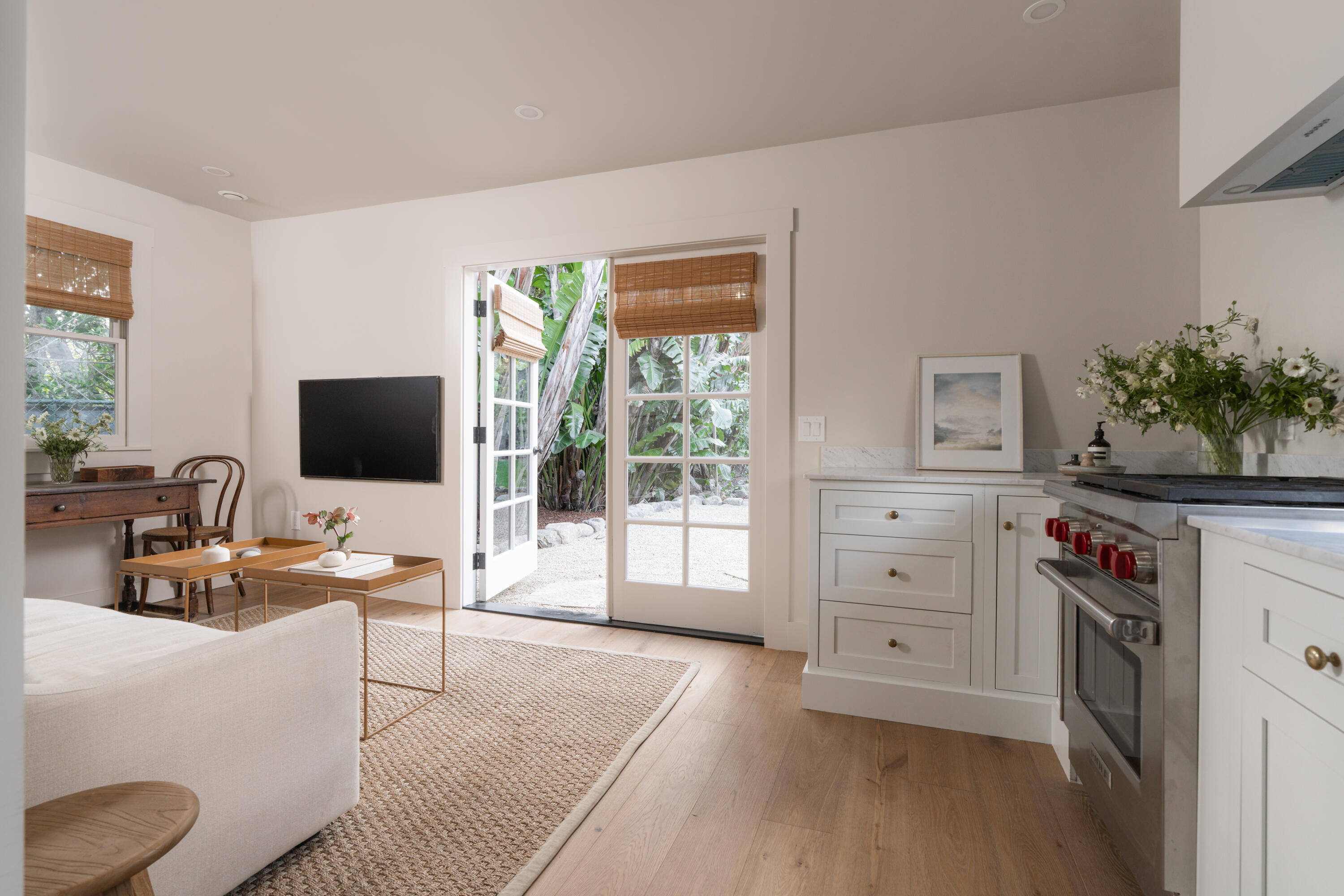 1575 East Valley Road Montecito, CA 93108 - Photo 26 of 30 a living room with furniture a flat screen tv and a floor to ceiling window