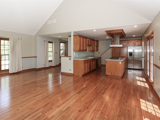 243 Bradwell Road Inverness, IL 60010 - Photo 11 of 25 a living room with stainless steel appliances kitchen island wooden floors and large window