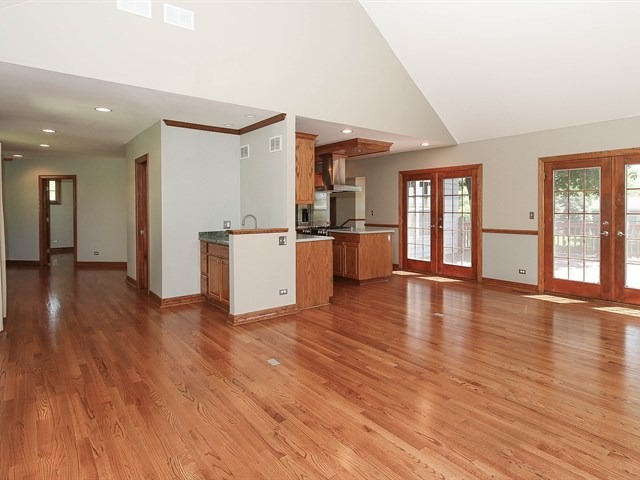 243 Bradwell Road Inverness, IL 60010 - Photo 12 of 25 an empty room with wooden floor and windows