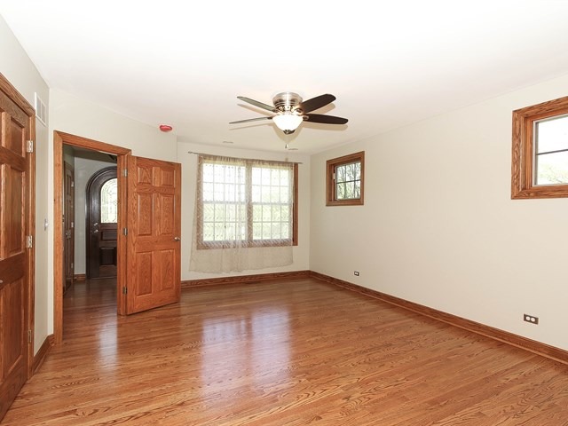 243 Bradwell Road Inverness, IL 60010 - Photo 14 of 25 wooden floor in an empty room with a window