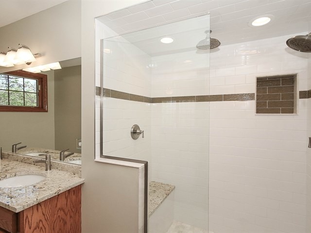 243 Bradwell Road Inverness, IL 60010 - Photo 16 of 25 a bathroom with a granite countertop sink and a mirror