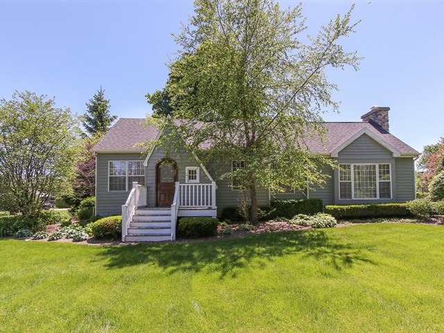 243 Bradwell Road Inverness, IL 60010 - Photo 3 of 25 a front view of house with yard and trees in the background
