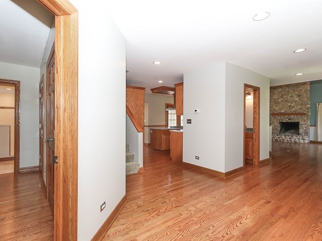 243 Bradwell Road Inverness, IL 60010 - Photo 4 of 25 a view of a kitchen and an empty room with wooden floor