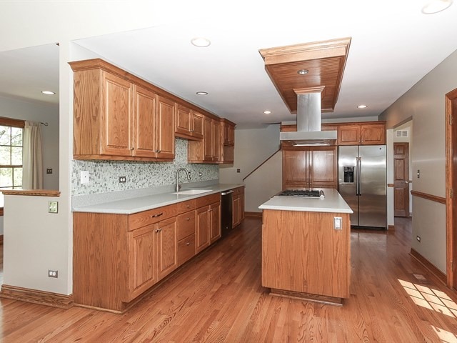 243 Bradwell Road Inverness, IL 60010 - Photo 6 of 25 a kitchen with stainless steel appliances granite countertop a stove a refrigerator and a sink
