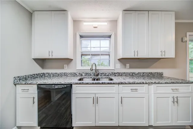 a view of empty room with wooden floor and windows