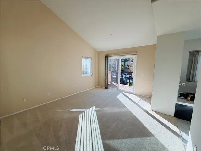 a view of livingroom with furniture and front door