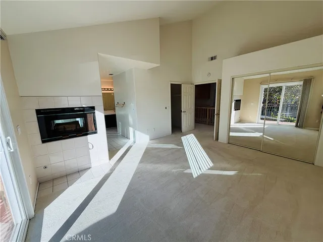 a view of a livingroom with furniture and flat screen tv