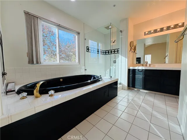 a kitchen with stainless steel appliances a sink stove and cabinets