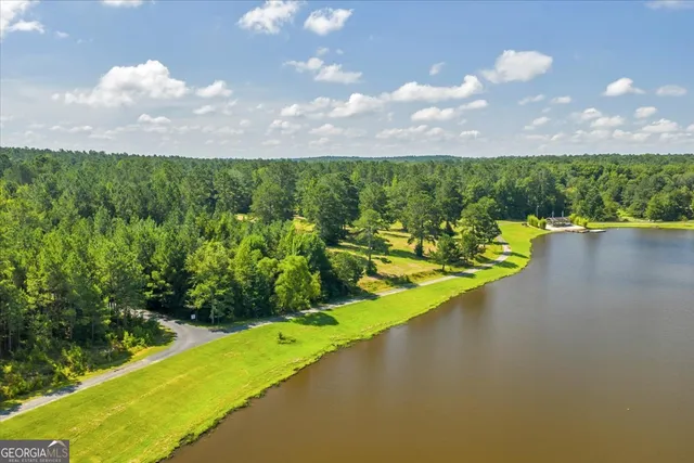 a view of a lake with a yard