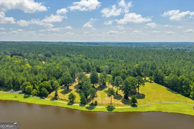 a view of a lake with a yard
