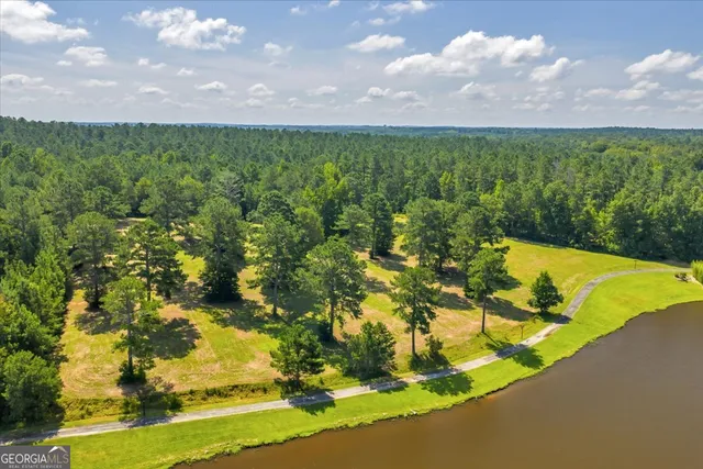a view of a swimming pool with an outdoor space and seating area
