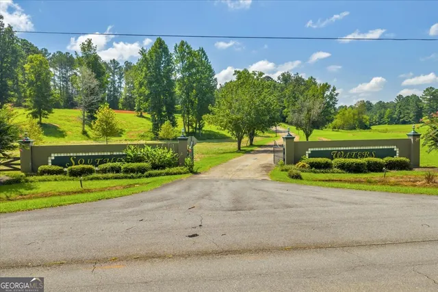 a view of swimming pool with a yard and sitting area