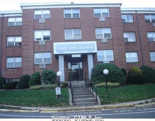 1730 State Street, Unit 207 Hamden, CT 06517 - Photo 1 of 1 a front view of a house with a yard and garage