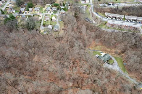 a aerial view of a house with a yard