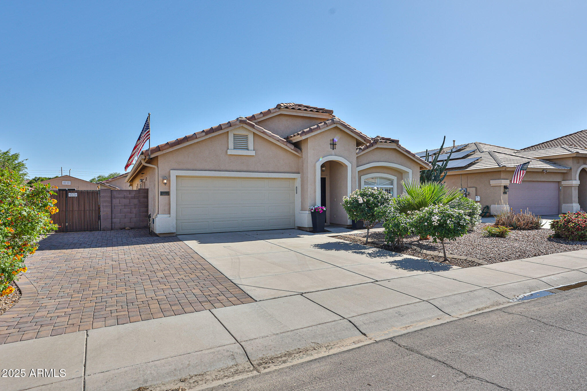 15731 West Redfield Road Surprise, AZ 85379 - Photo 1 of 48 a front view of a house with a garden
