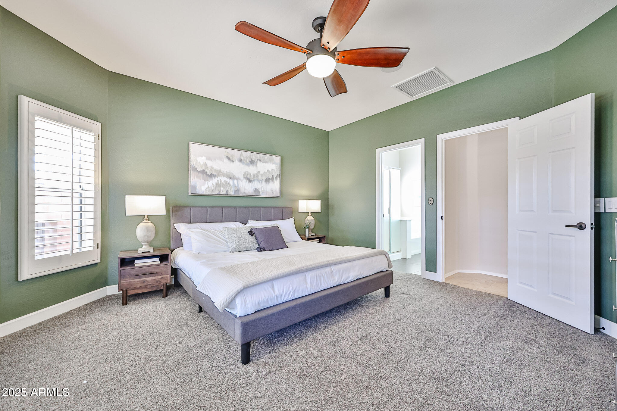 15731 West Redfield Road Surprise, AZ 85379 - Photo 29 of 48 a bedroom with a bed and a window