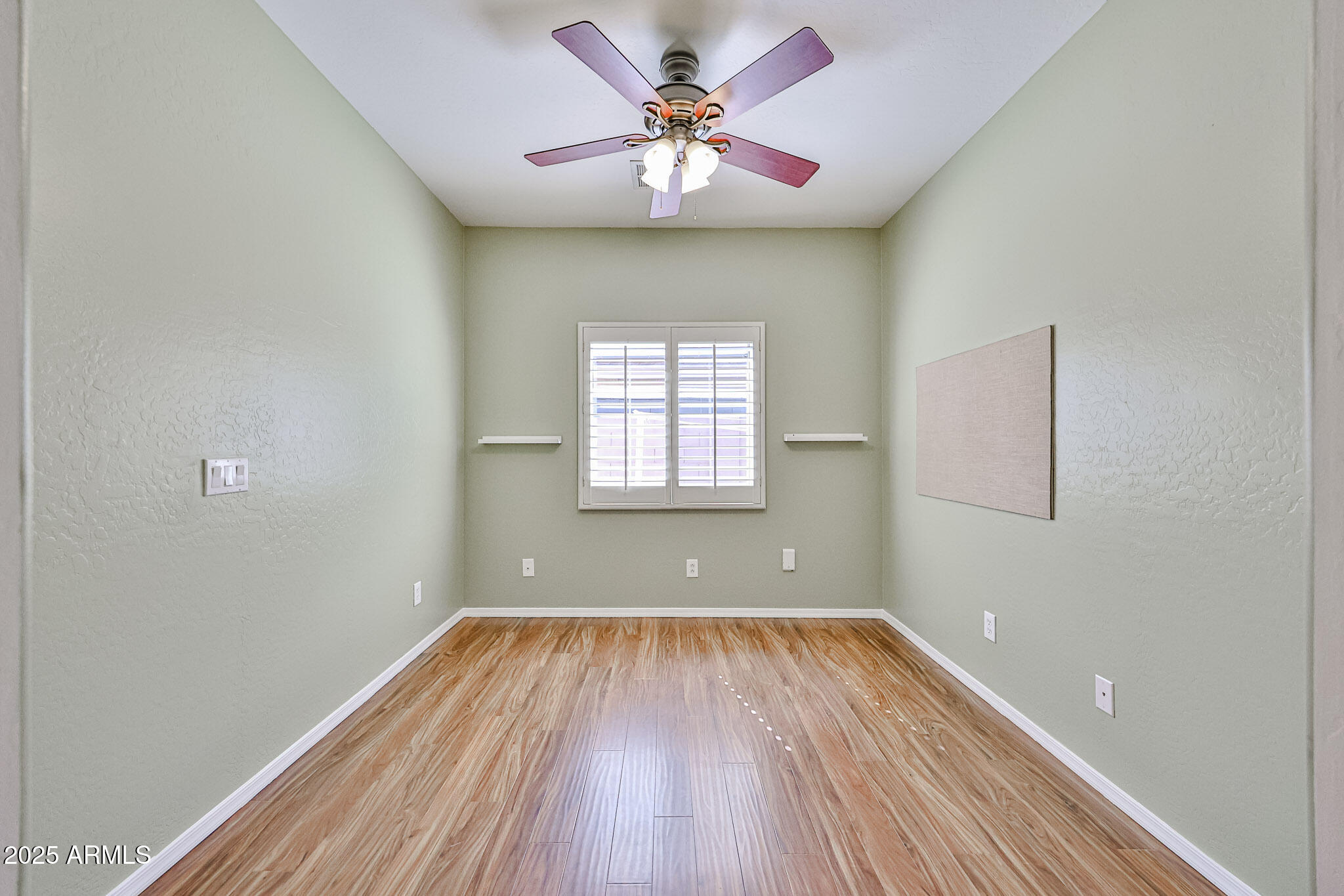 15731 West Redfield Road Surprise, AZ 85379 - Photo 36 of 48 wooden floor in an empty room with a window