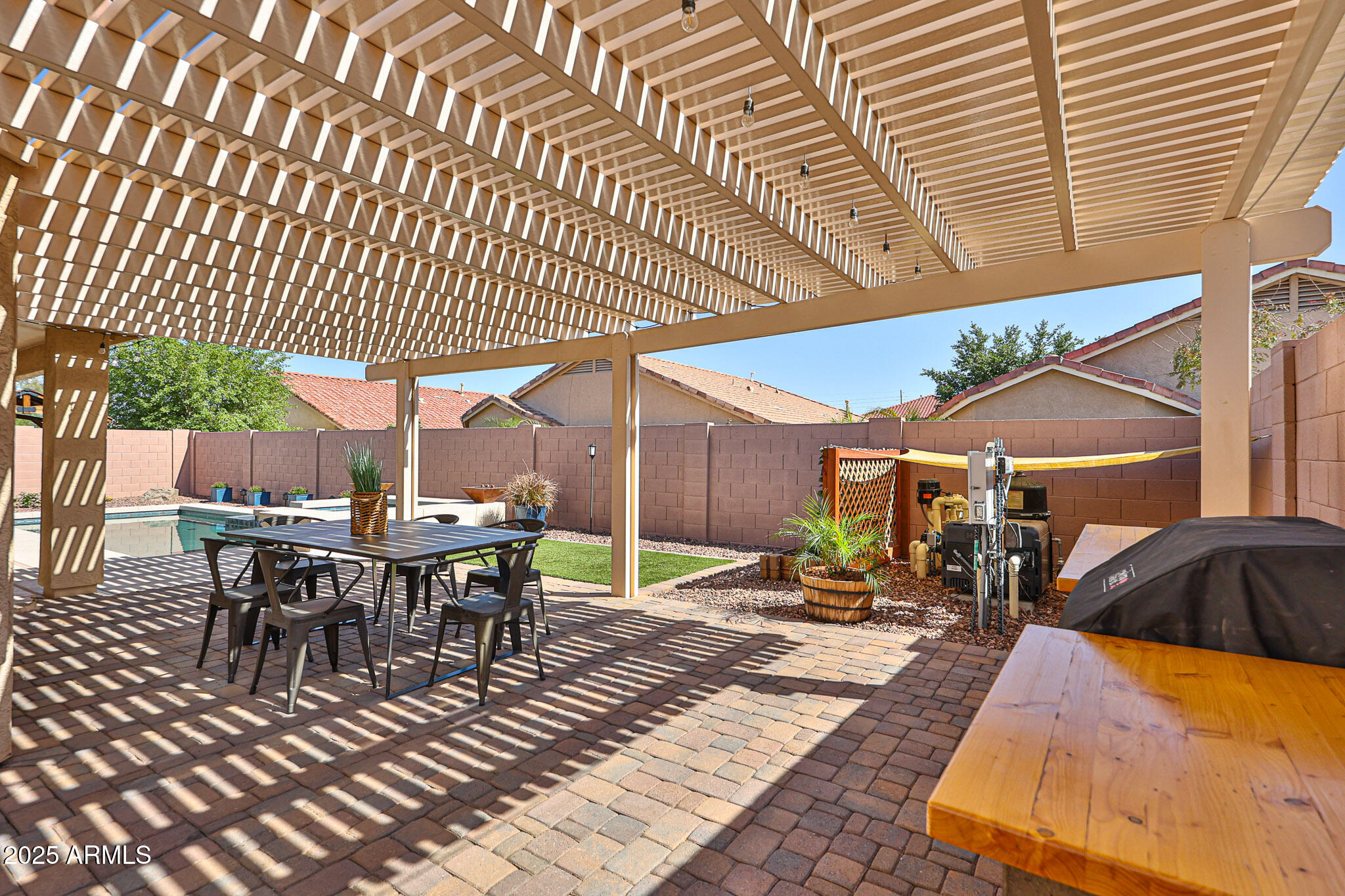 15731 West Redfield Road Surprise, AZ 85379 - Photo 41 of 48 a view of a patio with table and chairs with wooden floor and fence
